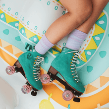 Lifestyle shot of the BTFL Liam Pro Roller skate positioned on pool float