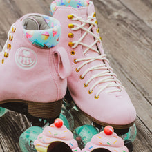 Lifestyle shot of the BTFL Ava Pro Roller skate with with cupcake glasses